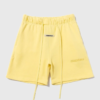 Short amarillo Essentials Logo